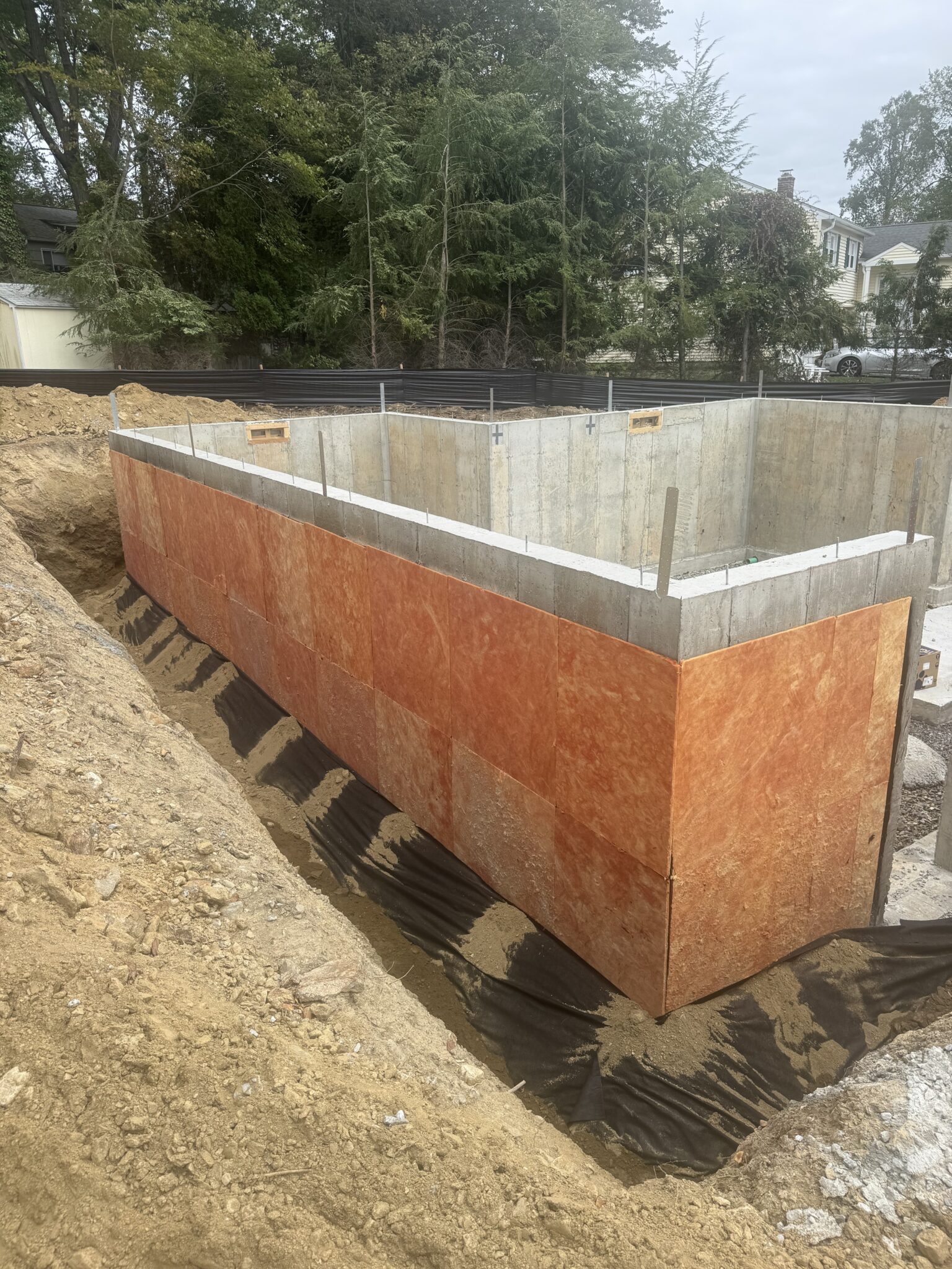 Concrete Foundation with Tuff N Dri Waterproofing and IDP Barrier Board